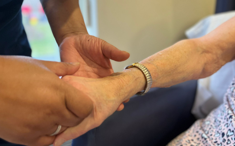 a-nurse-holds-a-patients-hand