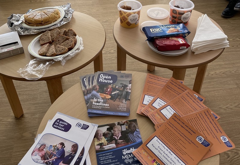 leaflets-cakes-and-snacks-laid-out-on-coffee-tables
