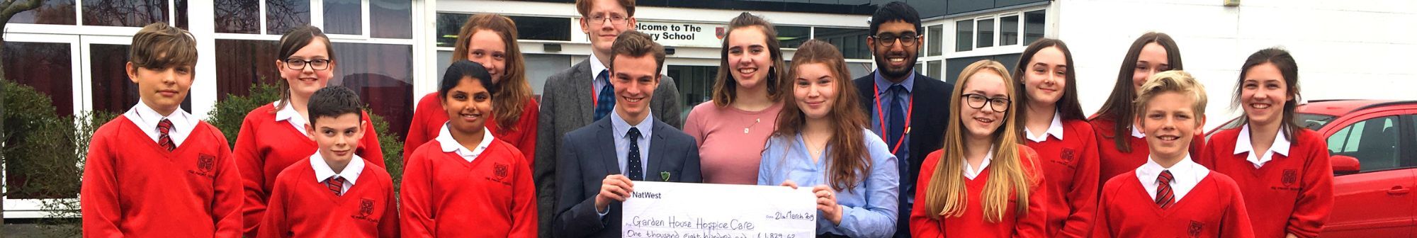 priory-school-students-standing-with-a-cheque