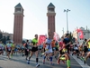 runners-passing-the-venetian-towers-in-the- barcelona-marathon