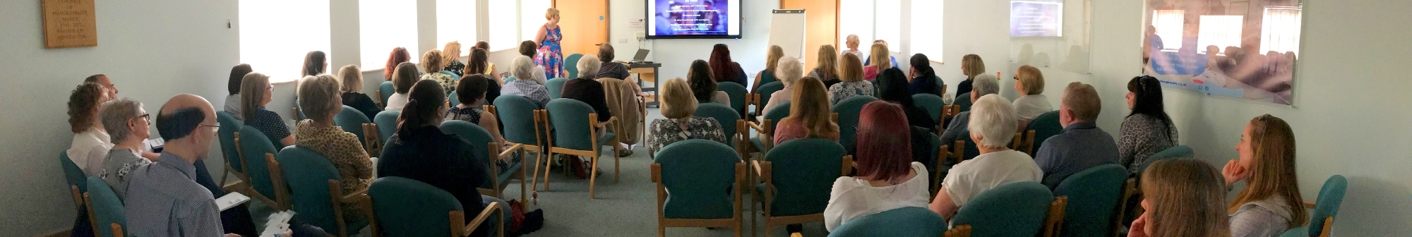 people-watching-a-presentation-at-a-training-session