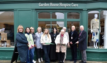 hospice-staff-volunteers-and-trustees-stand-outside-our-baldock-shop