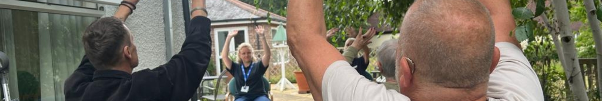 john-takes-part-in-an-outdoor-seated-tai-chi-class