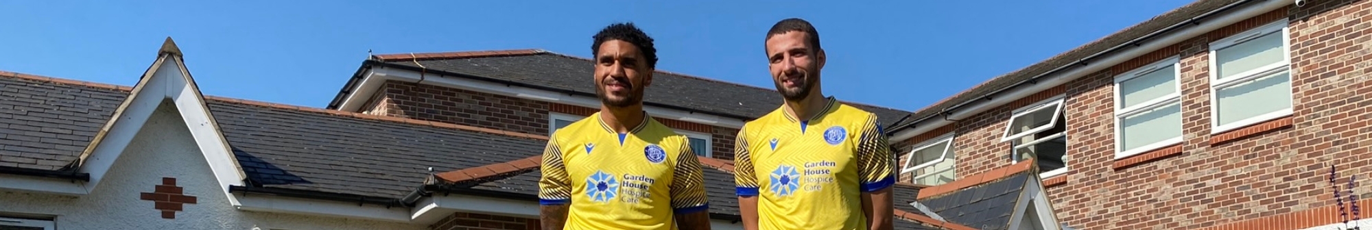two-stevenage-footballers-in-the-hospice-gardens-wearing-new-third-kit