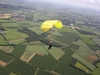ariel-view-of-skydiver-and-instructor-over-fields