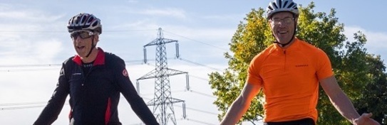 two-men-on-bikes-in-pedals-for-pounds (cropped)