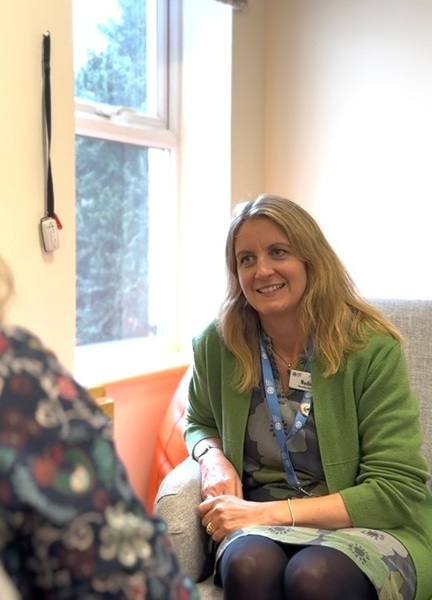 counsellor-smiling-while-talking-to-a-service-user (cropped)