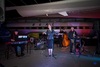 a-band-perfoming-in-front-of-an-aircraft