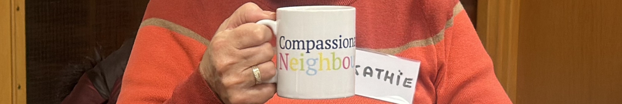persons-hand-holding-a-coffee-mug