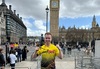 runner-wearing-london-landmarks-shirt-and-medal-in-front-of-big-ben
