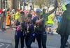 three-runners-cheering-wearing-team-garden-house-running-tops-and-london-landmarks-medals