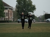 two-runners-holding-hands-on-broadway-gardens-at-the-flawed-hero-marathon