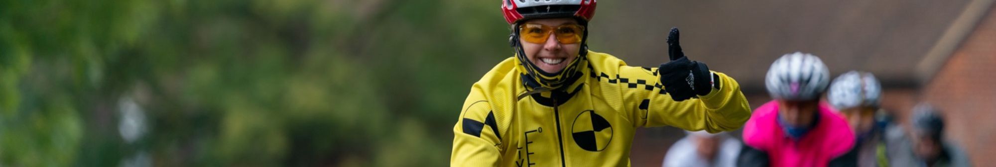 woman-on-bike-with-thumbs-up