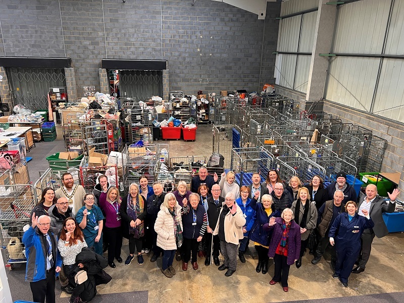 staff-and-volunteers-inside-the-depot-where-donations-are-sorted