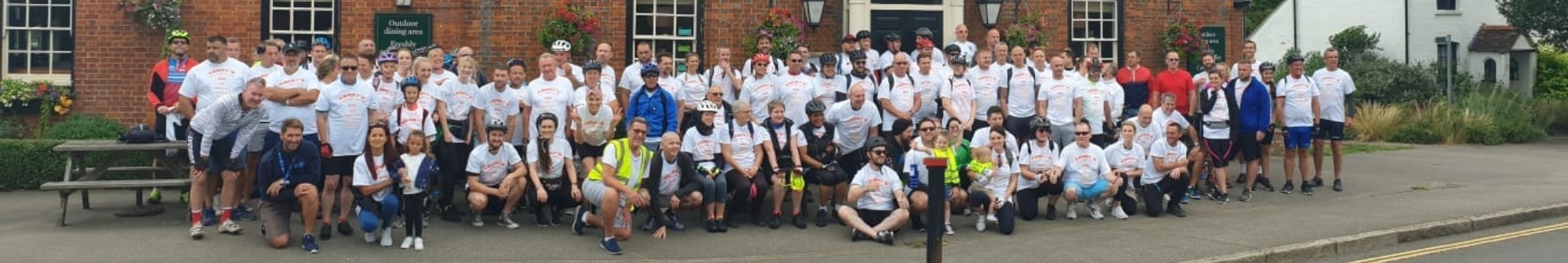 a-crowd-of-people-outside-a-pub-ahead-of-bike-ride