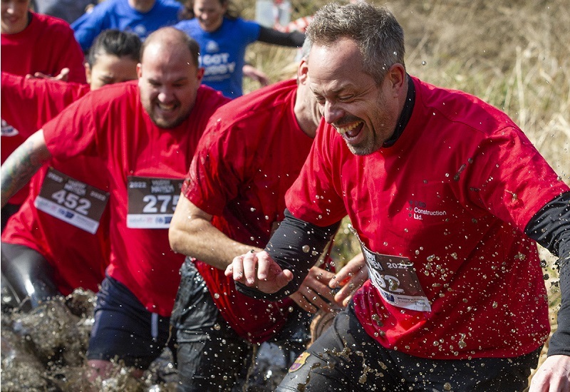 team-wades-through-mud-at-muddy-mayhem