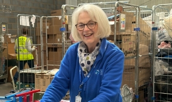 volunteer-sorter-smiling-at-the-depot