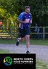 runner-at-standalone-10k-wearing-garden-house-hospice-care-top