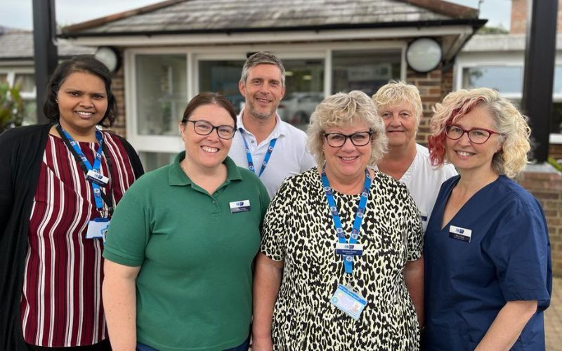 a-group-of-hospice-staff-stand-together