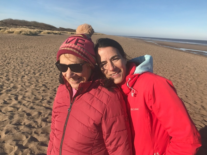june-and-daughter-jules-smiling-on-the-beach