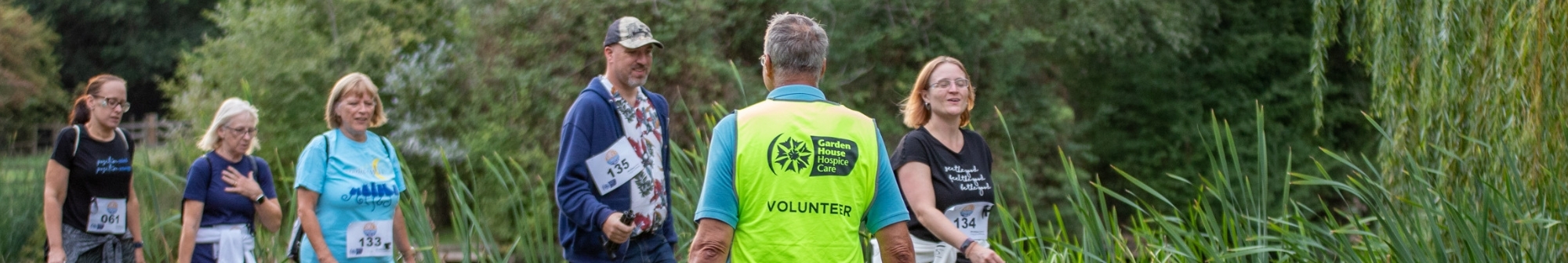 events-volunteer-marshall-guiding-walkers-across-a-road