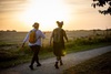 two-girls-walking-with-the-sunset-in-the-background
