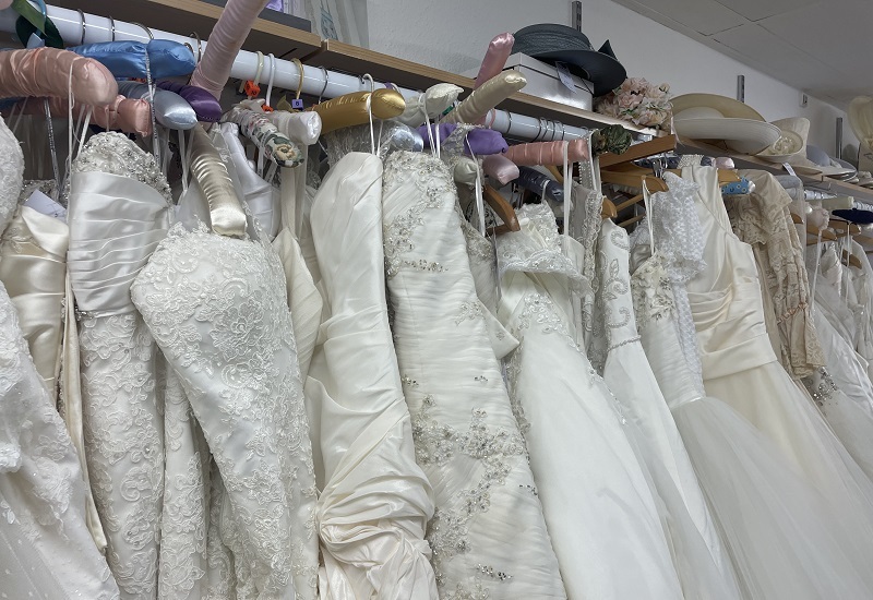 wedding-dresses-hangong-on-display-in-bridal-house
