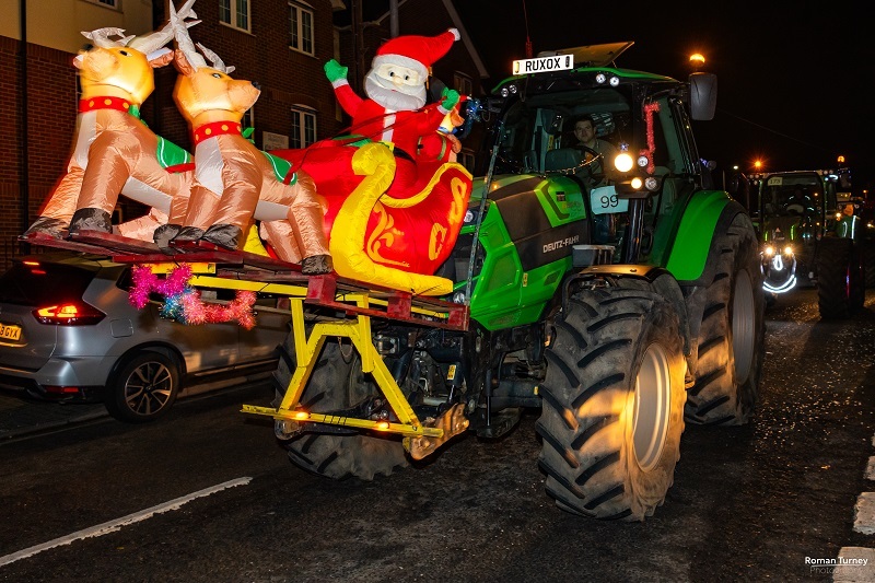 tractor-decorated-in-christmas-lights-and-inflatable-santa-and-reindeer