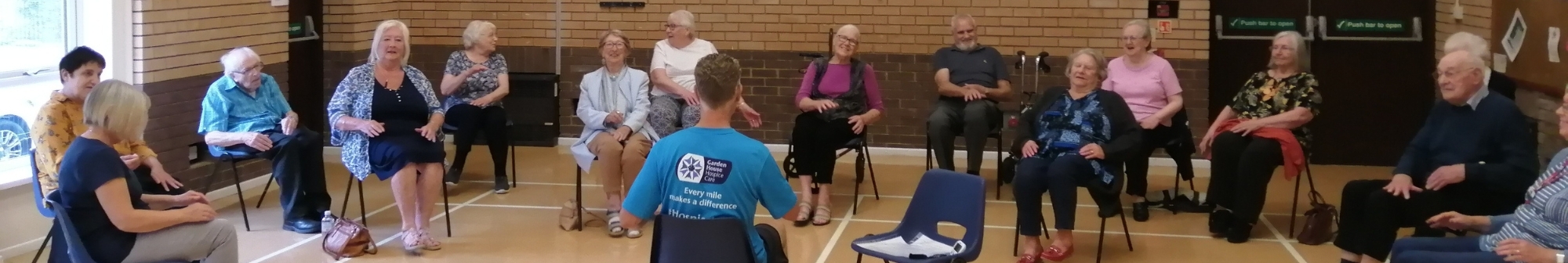 hub-coordinator-gez-leads-a-seated-exercise-class