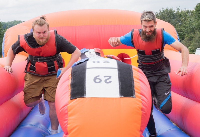 two-men-race-on-an-inflatable-bungee-obstacle