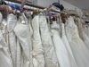 bridal-gowns-hanging-from-a-rail