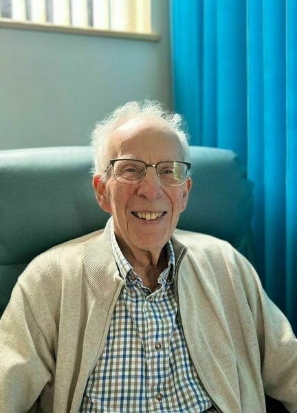 frailty-patient-roger-russell-smiles-on-inpatient-unit (cropped)