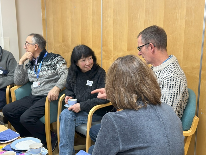volunteers-drinking-tea-and-chatting-at-a-social-event