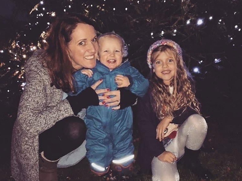 ally-with-her-young-children-in-front-of-the-chirstmas-tree-at-lights-of-life