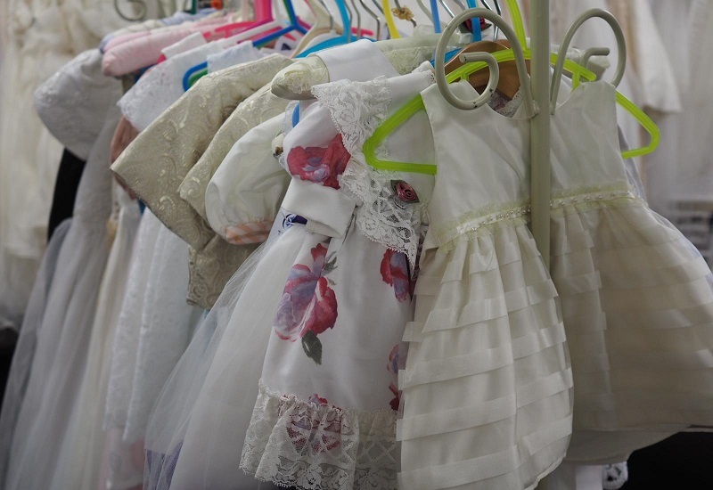 childrens-occasionwear-dresses-hanging-on-rail