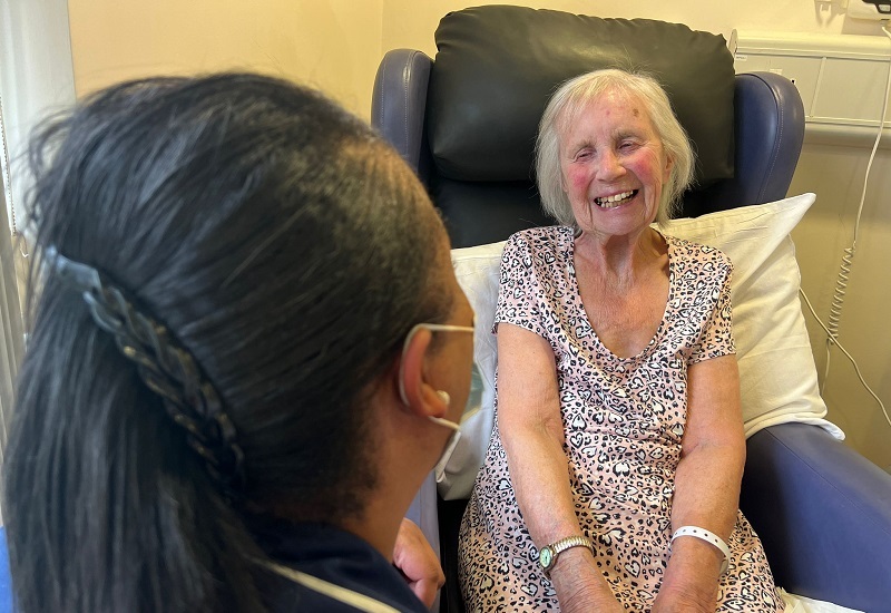 patient-vera-laughs-while-chatting-to-nurse