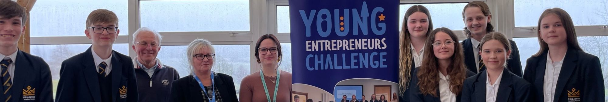 students-pose-with-dragons-at-young-enterpreneurs-challenge