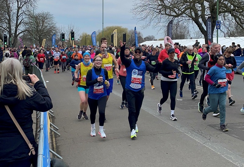 verena-and-eric-running-in-hospice-branded-vests