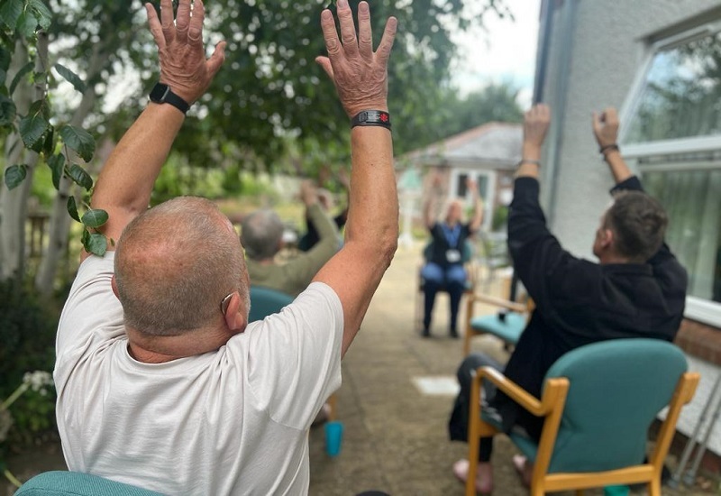 an-outdoor-seated-tai-chi-class