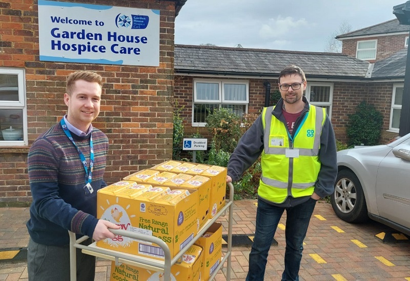co-op-worker-gifts-trolley-of-donated-eggs-to-hospice-staff-member