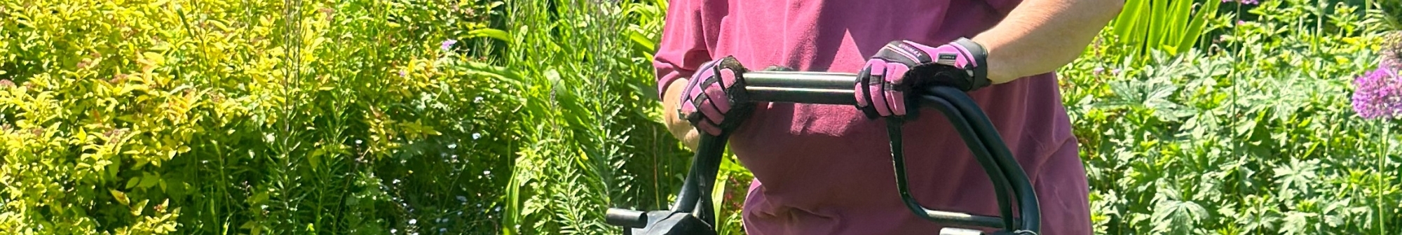 volunteer-gardener-mowing-the-lawn