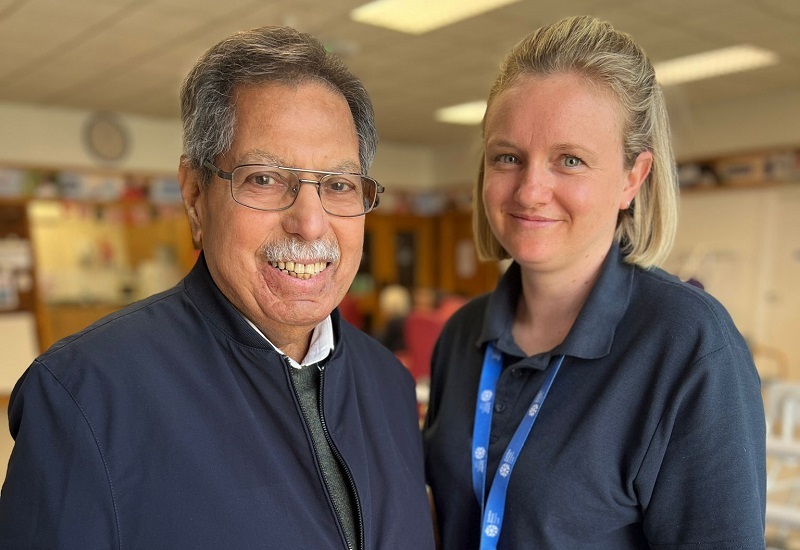 ahmed-stands-and-smiles-with-physio-jayne