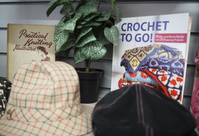 hats-and-books-on-a-shop-shelf