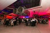 guests-sat-around-tables-below-the-concorde-engine
