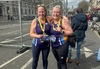 two-runners-smiling-wearing-garden-house-hospice-care-vests-and-london-landmarks-medals