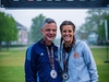 two-runners-smiling-wearing-medals-at-the-flawed-hero-marathon-finish-line