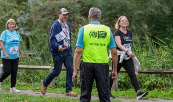 events-volunteer-marshall-guiding-walkers-across-a-road