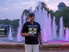 runner-cheers-in-front-of-broadway-fountain-at-the-flawed-hero-marathon