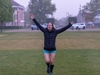runners-throws-her-arms-in-the-air-as-she-approaches-flawed-hero-marathon-finish