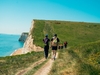 group-hiking-toward-durdle-door-on-the-jurassic-coast-ultra-challenge